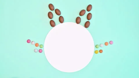Easter bunny made with copy space round paper and chocolate eggs. Stop motion Stock-Footage 233245007