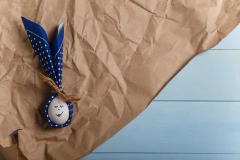 Easter bunny made from egg and polka dot napkin ears on brown paper Stock Photos