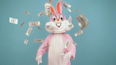 Easter bunny or rabbit or hare hold fan of dollar, throws dollars, money falls Stock Footage 147971467