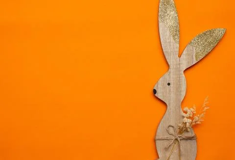 Easter bunny on an orange background (Easter) Stock Photos