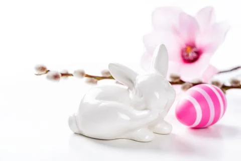 An easter bunny with a pink easter egg Photos