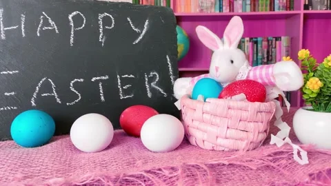 Easter bunny rabbit with colored eggs Stock Footage 168017097