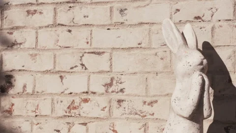 Easter Bunny Rabbit Statue Against Brick Wall Stock Footage 295330571