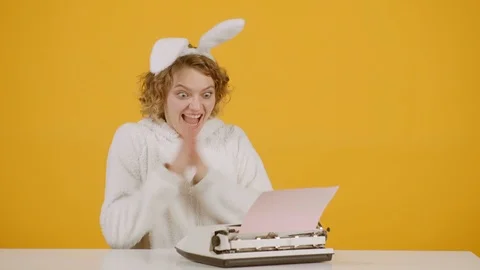 Easter bunny rabbit woman using mechanical typing machine for congratulation Stock Footage 124918792