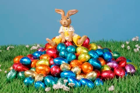 Easter bunny sits eggs egg legal holiday sweets Stock Photos
