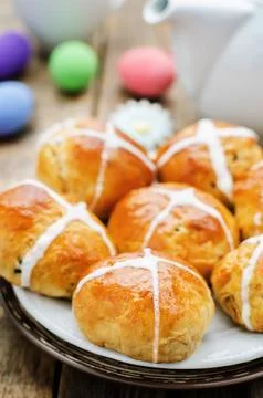 Easter buns with a cross and eggs on a dark wood background. tinting. selec.. Stock Photos
