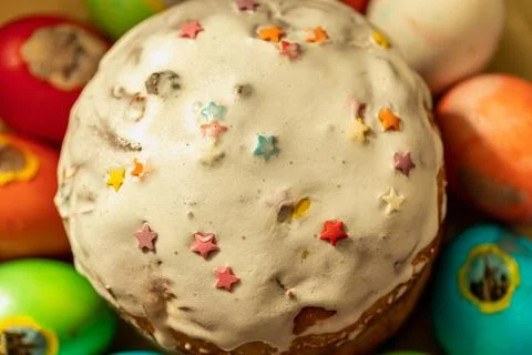Easter cake and chicken eggs of different colors. Stock Photos