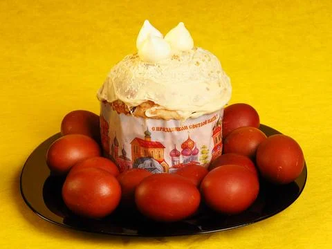 Easter cake and colored eggs. Festive food. Stock Photos