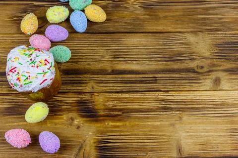 Easter cake and easter eggs on a wooden table. Top view, copy space Stock Photos