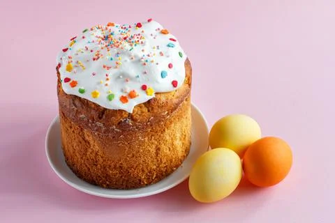 Easter cake and eggs on kitchen table. Stock Photos