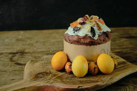 Easter cake and eggs. Still life on a dark background. Stock Photos