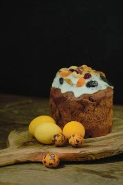 Easter cake and eggs. Still life on a dark background. Stock Photos