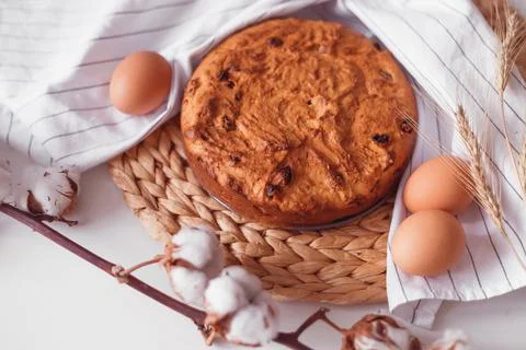 Easter cake and eggs on wicker cloth. Isolated on white. Cookies pie or cake  Stock Photos