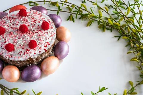 Easter cake and painted Easter eggs with willow branches. Stock Photos