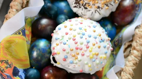 Easter cake and painted eggs in a basket Stock Footage 88209514