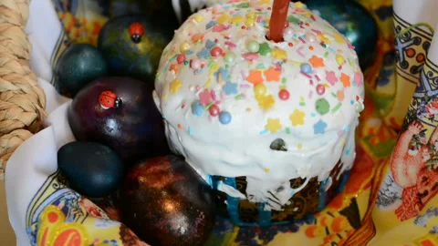 Easter cake and painted eggs in a basket Stock Footage 88212467
