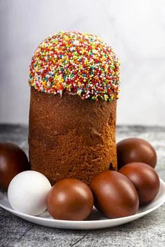 Easter cake and red eggs on a table. Easter background. Stock Photos