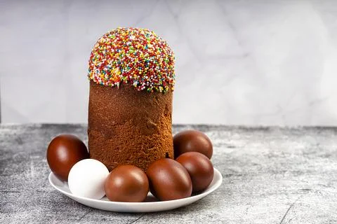 Easter cake and red eggs on a table. Easter background. Stock Photos