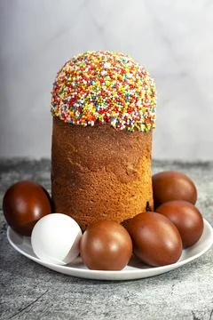 Easter cake and red eggs on a table. Easter background. Stock Photos
