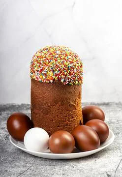 Easter cake and red eggs on a table. Easter background. Stock Photos