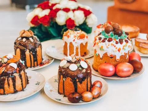 Easter cake and red painted eggs, white apricot flowers Stock Photos