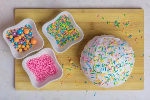Easter cake and three plates with decorations Stock Photos
