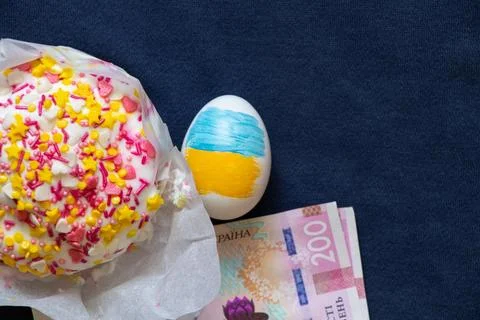 Easter cake and two hundred hryvnia bills and an egg with the flag of Ukraine Stock Photos