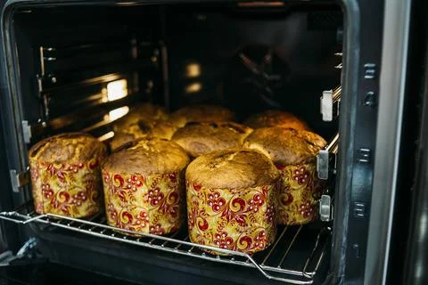 Easter cake cooking in oven Stock Photos