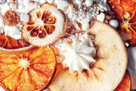 Easter cake decor. Cooked fruitcake decorated dry oranges, pears, meringue Stock Photos