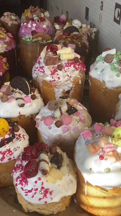 Easter cake is decorated with icing, candied fruits, nuts and chocolate Stock Footage 167203749
