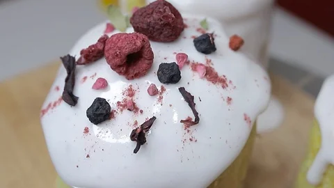 Easter cake decorated with raspberries, currants and berry petals. Stock Footage 128567014