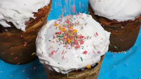 Easter cake decoration. Easter cake in white glaze sprinkled with colored icing Stock Footage 226012431