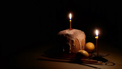 Easter cake, easter eggs and church candles in the dark. Stock Footage 132354950