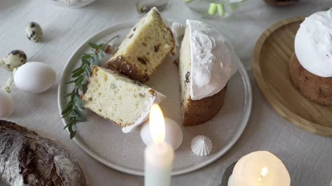 Easter cake, eggs and a candles on the table Stock Footage 153800723