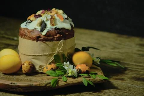Easter cake, eggs and Murraya branch. Still life on a dark background Stock Photos