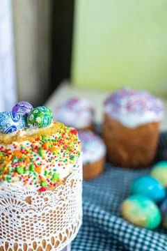 Easter cake with glace icing and colored easter eggs rustic style Stock Photos