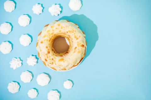 Easter cake with meringue on blue background. Polish babka - traditional Easter Stock Photos