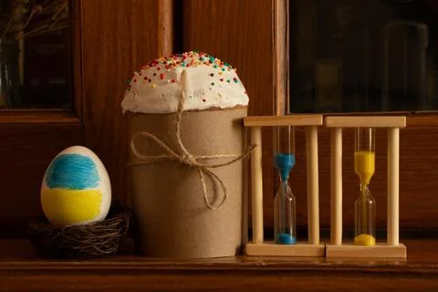 Easter cake with a painted egg in the colors of the Ukrainian flag and an h.. Stock Photos