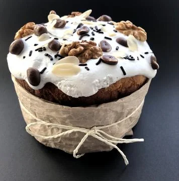 Easter cake with peanuts and nuts on black background Stock Photos