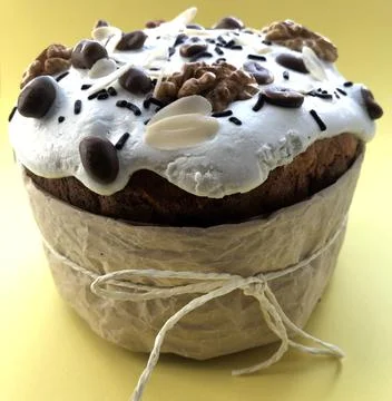 Easter cake with peanuts and nuts on yellow background Stock Photos