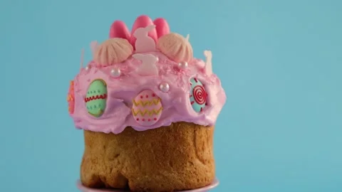 Easter cake with pink icing.cake decoration cooking process. Stock Footage 302992682