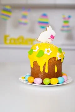 Easter cake with a rabbit and painted eggs on the table. Religious holiday. Stock Photos