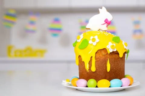 Easter cake with a rabbit and painted eggs on the table. Religious holiday Stock Photos