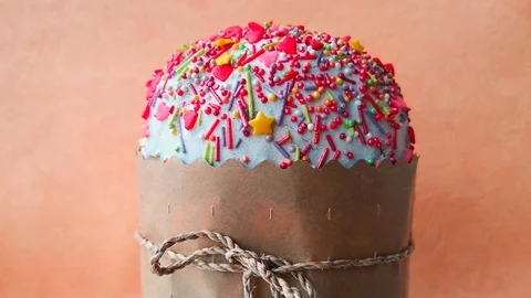 Easter cake rotates on orange background Stock Footage 106309903