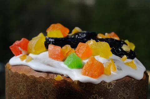Easter cake sprinkled with sweets closeup Stock Photos