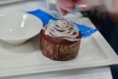 Easter cake on a square plate, with colored decoration Stock Photos