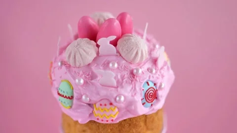 Easter cake with sugar decorations in pastel pink tones on a pink background Stock Footage 299032380