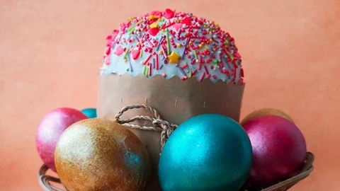 Easter cake surrounded by bright shiny Easter eggs Stock Footage 106309909