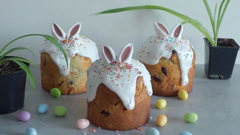 Easter cake three02404969 Flat Lay Decorating Bunny ears Easter cake Stock Footage 303151211