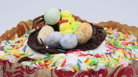 Easter cake turning against gray background Stock Footage 277151200